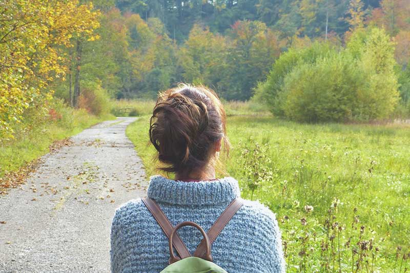 woman walking in the country for immunity IV infusions